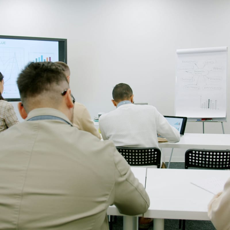 Businesswoman giving a presentation to colleagues in an office